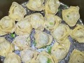 美味生煎饺的制作方法（掌握生煎饺的秘密，让你轻松做出香脆可口的美味佳肴！）