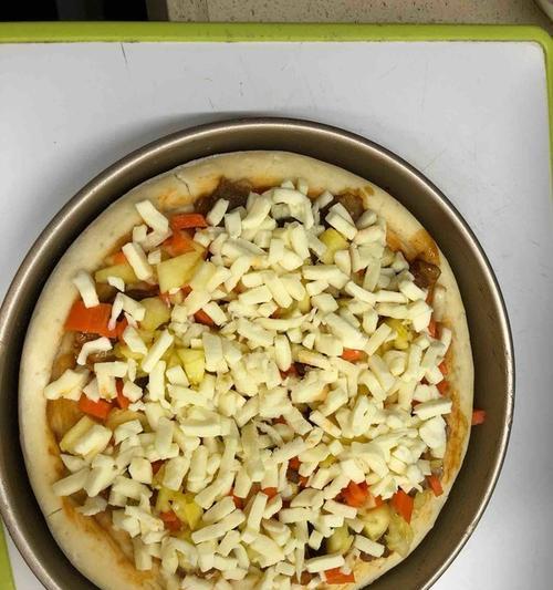 圣女果牛肉披萨的制作方法（一步步教你做出口感丰富的美味披萨）-第2张图片-美味行家